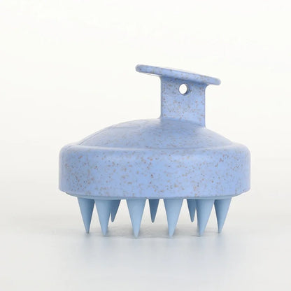 Blue scalp massager on a white background