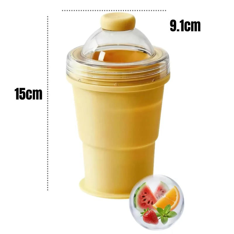 Yellow portable cup with measurements and a small inset of fruits.