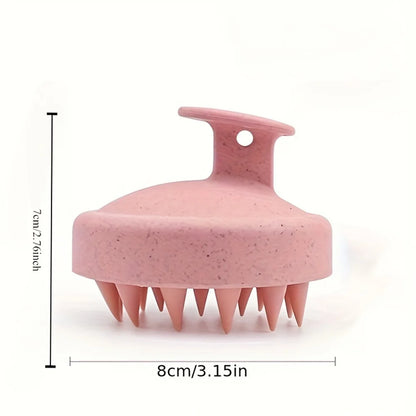 Pink scalp massager with dimensions indicated on a white background