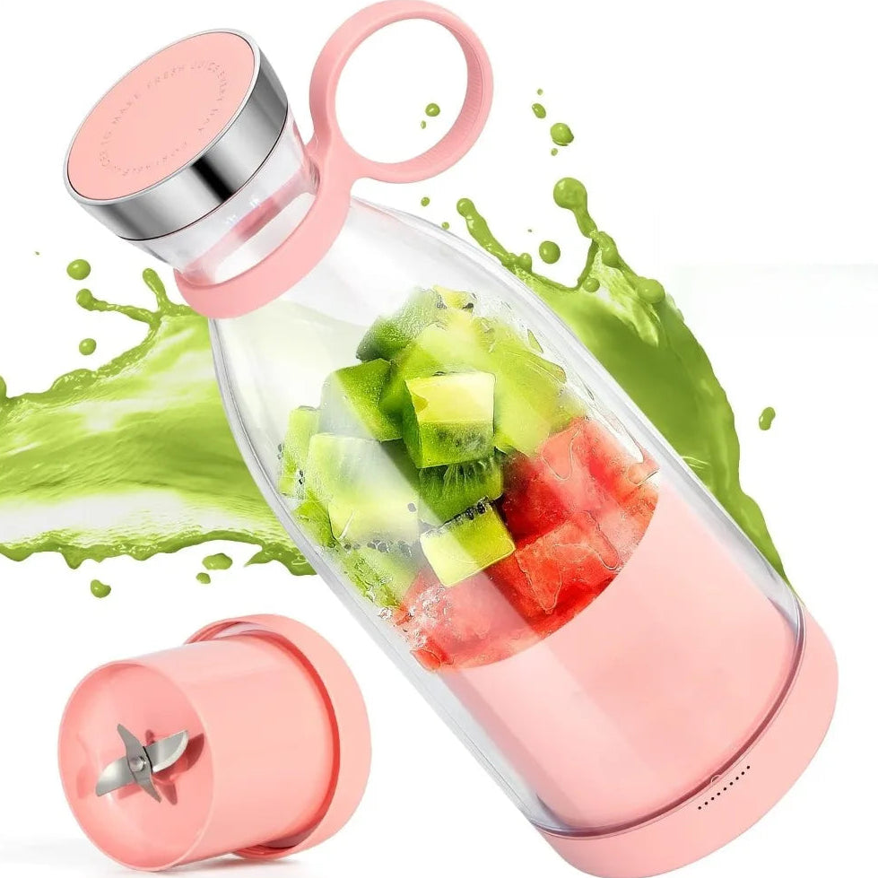 Pink and clear portable blender with fruits inside, surrounded by green juice splashes on a white background.